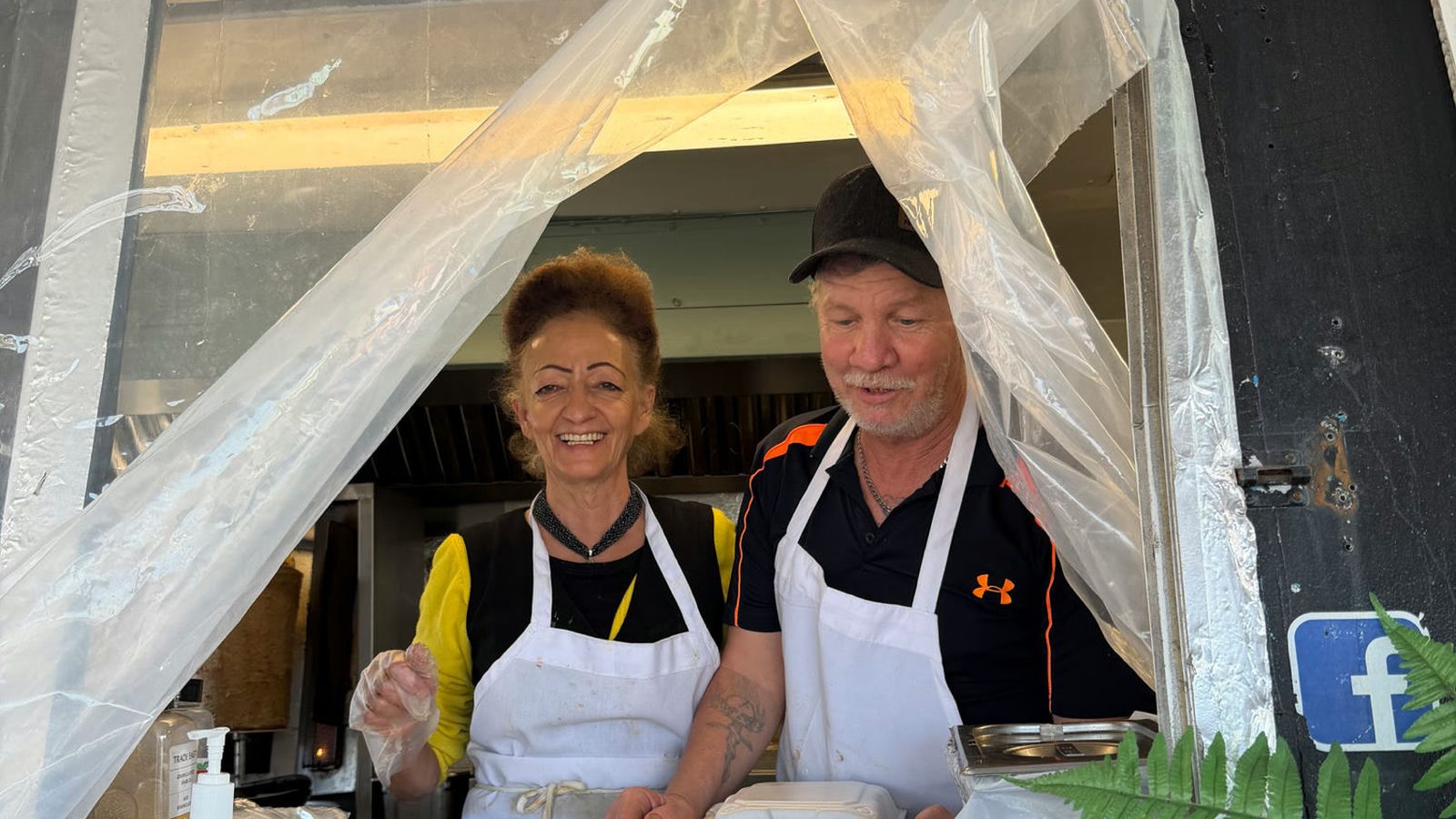 Maria and Nick at the service window of the Beachside Gyros truck